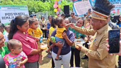 Sambut HAN, Bupati Mansnembra Canangkan Kampung Ramah Perempuan dan Peduli Anak